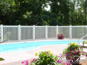 Vinyl picket fence around a pool