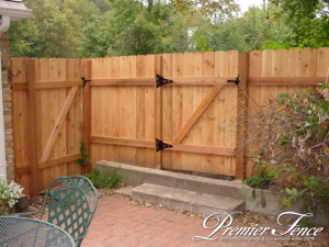 fence for kids western red cedar privacy gate around backyard for kid safety premier fence twin cities st. paul fence contractor