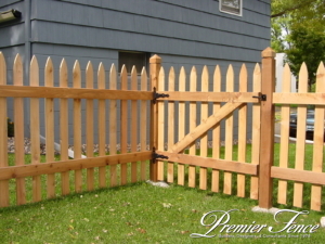 wood picket fence and gate around front yard