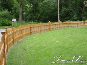 Wood picket fence around front yard for boundary and containment