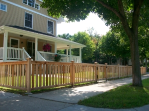 aesthetic Western red cedar picket design fence around front yard for containment and decor premier fence twin cities fence contractor