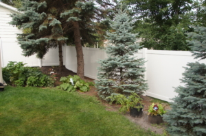 Digger Specialties Inc TriMax Design white privacy vinyl fence around backyard for privacy and security